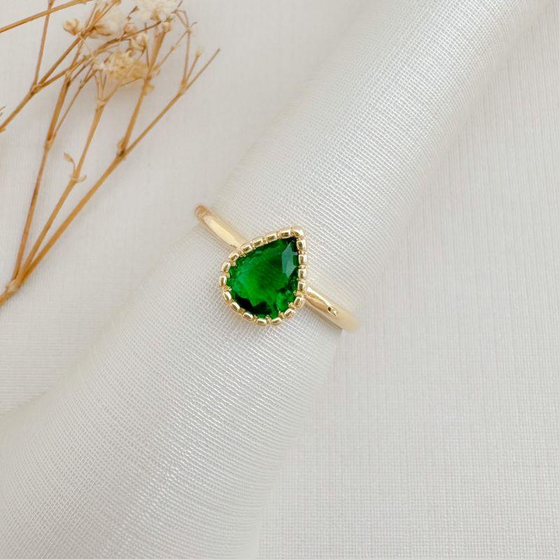 03.2488.5.O - (19) Anel solitário de gota em cravação barras em aro liso