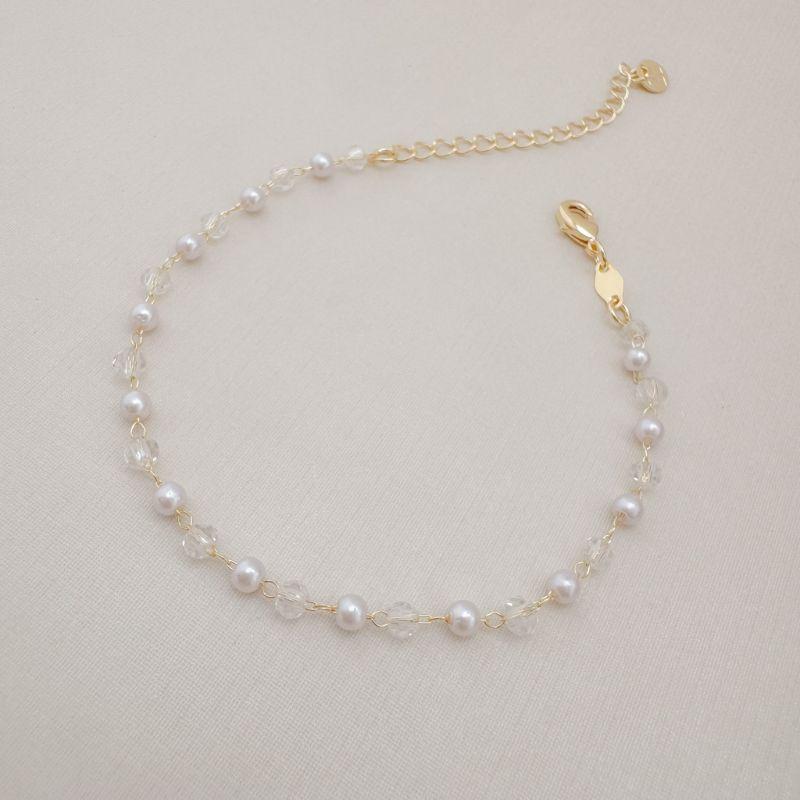 12.2113.15.O - Pulseira de bolinhas em resina pérola e resina cristal intercalados por inteiro