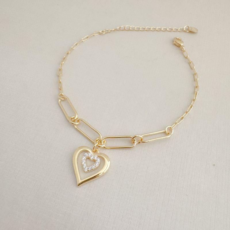 12.2212.1.O - Pulseira de elos longos com pingente de silhueta de coração liso com coração menor cravejado