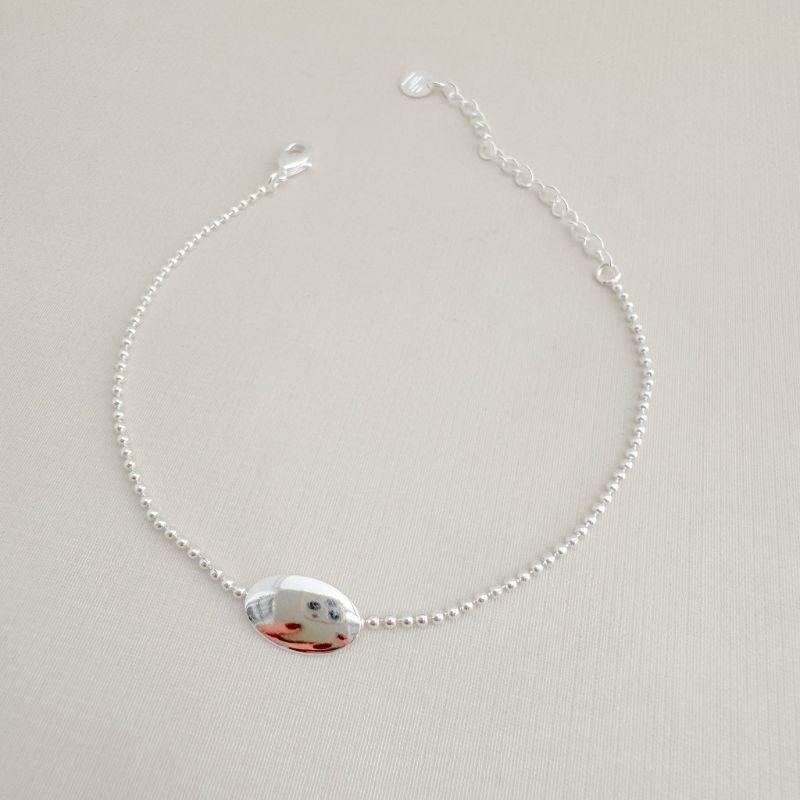 12.2215.0.S - Pulseira de bolinhas lisas com central em chapa oval lisa polida