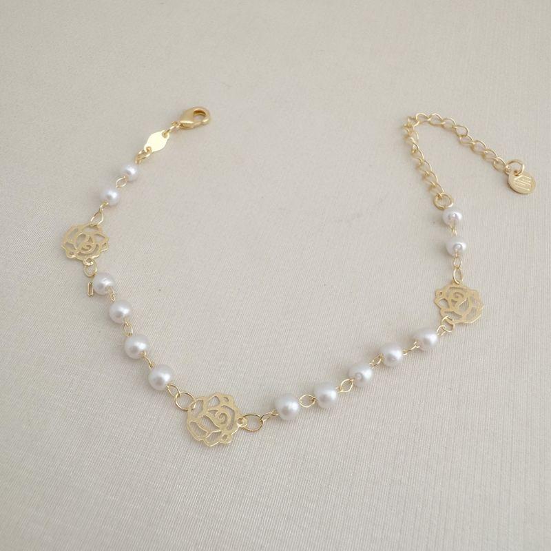 12.2220.15.O - Pulseira de bolinhas peroladas com silhuetas de flores lisas espaçadas