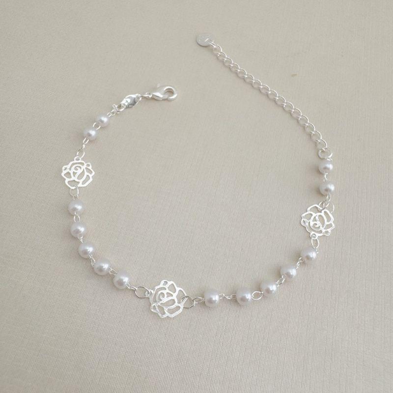 12.2220.15.S - Pulseira de bolinhas peroladas com silhuetas de flores lisas espaçadas