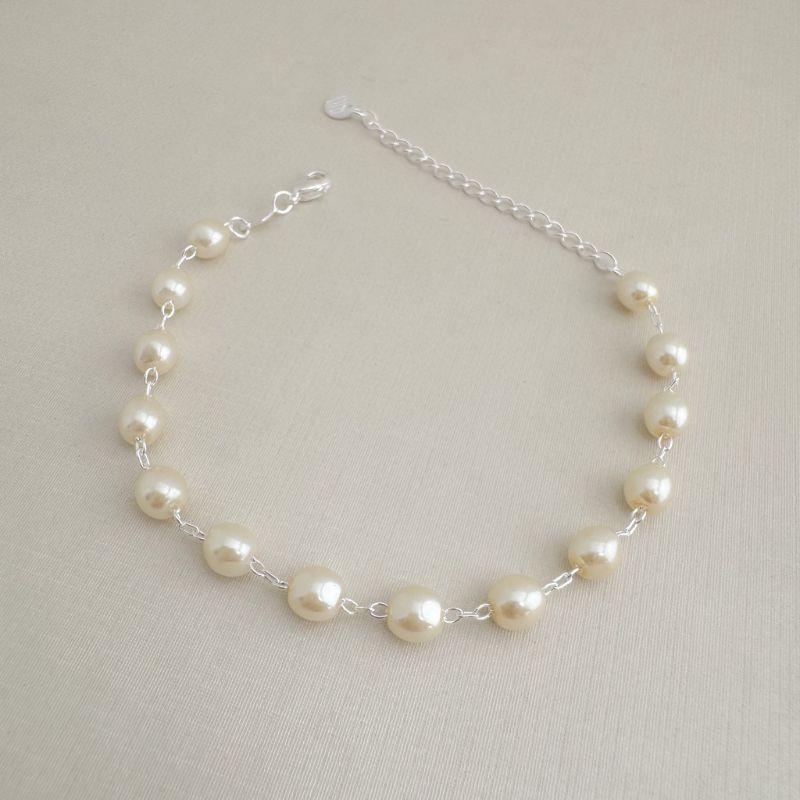 12.2221.15.S - Pulseira de perolados ovais em elos circulares clássicos