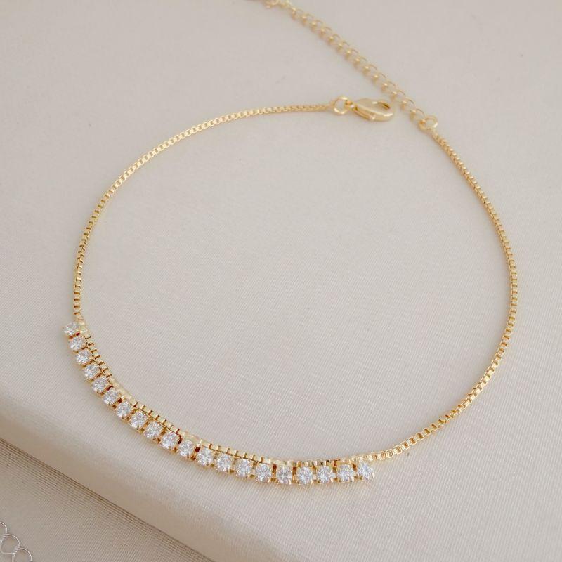 14.0308.1.O - Tornozeleira de elos veneziana com riviera em efeito cortina