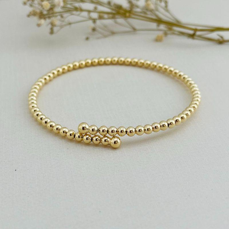 04.0198.0.O - Bracelete de mola aberta de multiplas bolinhas lisas