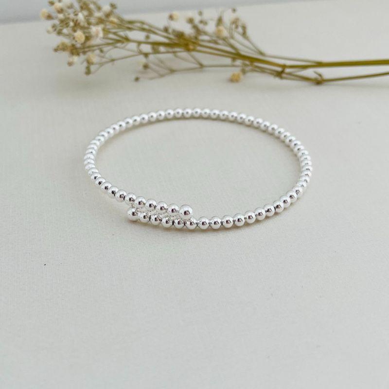 04.0198.0.s - Bracelete de mola aberta de multiplas bolinhas lisas