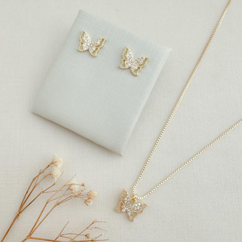 08.0611.1.O - (45) Conjunto de borboleta com central cravejada e borda espaçada em spikes