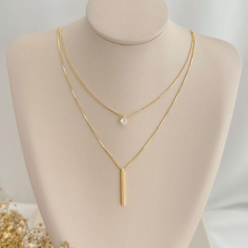 09.2374.1.O - (40) Colar duplo com ponto de luz e palito