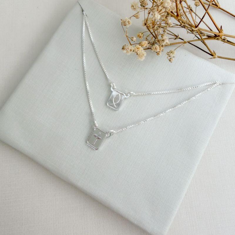 09.2410.0.S - (59) Escapulario de 8mm com imagem de cruz e peixe, cruz e Deus é Fiel