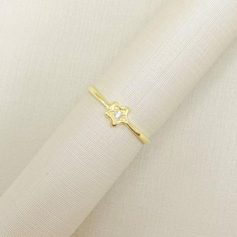 03.2537.1.O - (13) Anel de aro fino com estrela clássica central com ponto de luz