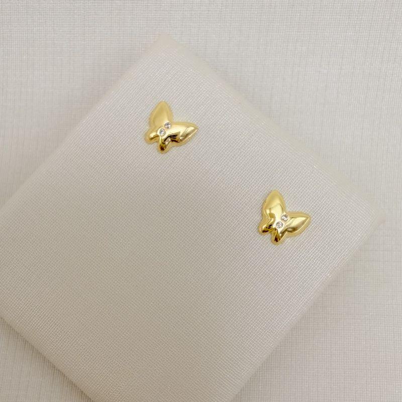 07.2819.1.O - Brinco de borboleta lisa com duas zircônias no centro, maior de três.