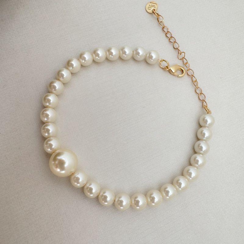 12.2207.15.O - Pulseira de pérolas médias com uma pérola grande no centro