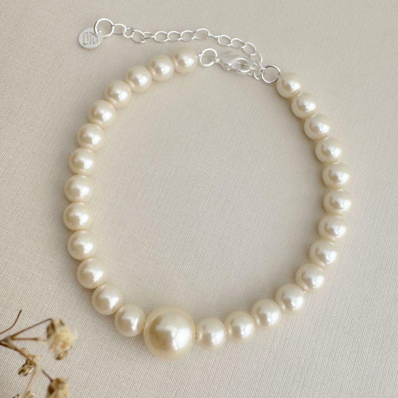 12.2207.15.S - Pulseira de pérolas médias com uma pérola grande no centro