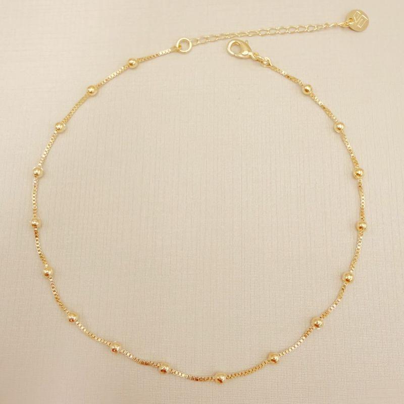 14.0313.0.O - Tornozeleira de veneziana com bolinhas lisas espaçadas