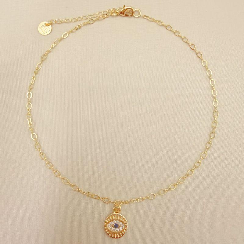 14.0318.4.O - Tornozeleira de elos ovais com pingente moeda com olho grego cravejado