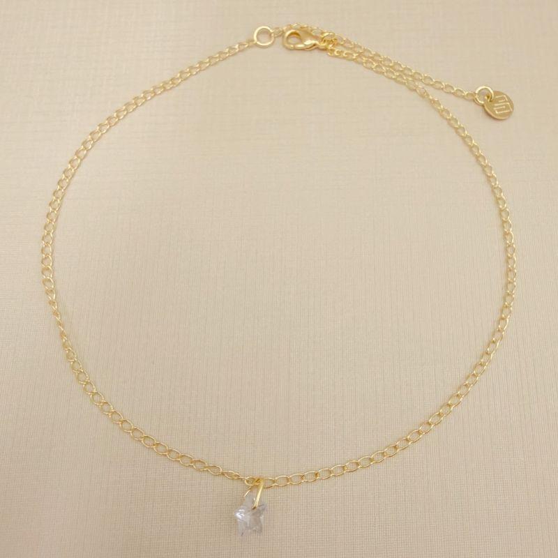 14.0319.1.O - Tornozeleira de elos clássicos lisos com pingente de ponto de luz em estrela