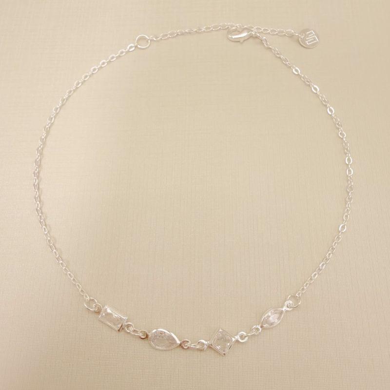 14.0323.0.S - Tornozeleira de elos simples com quatro pontos de luz em formato variado