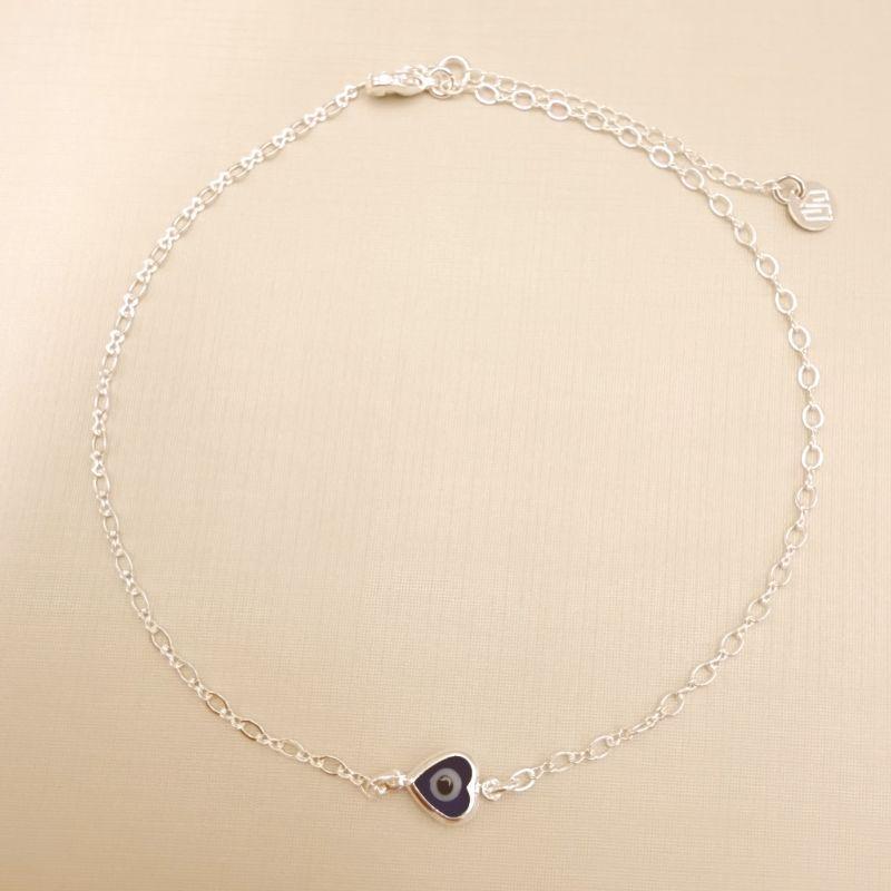 14.0333.20.S - Tornozeleira com coração de olho grego azul escuro e malha com elo longo e elo infinito.