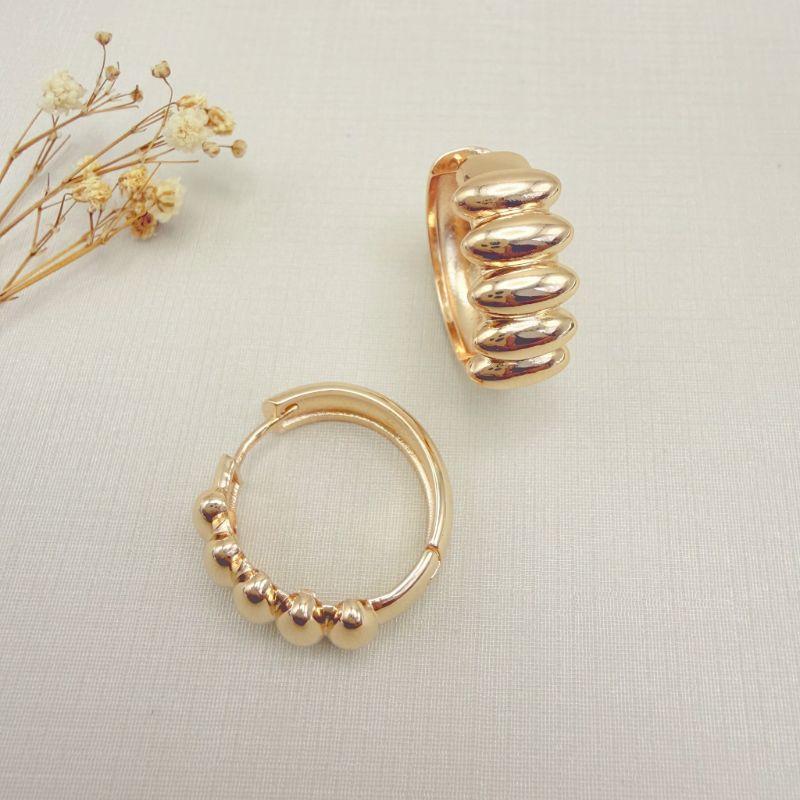 05.3122.0.O - Argola grande com parte frontal em cilindros lisos