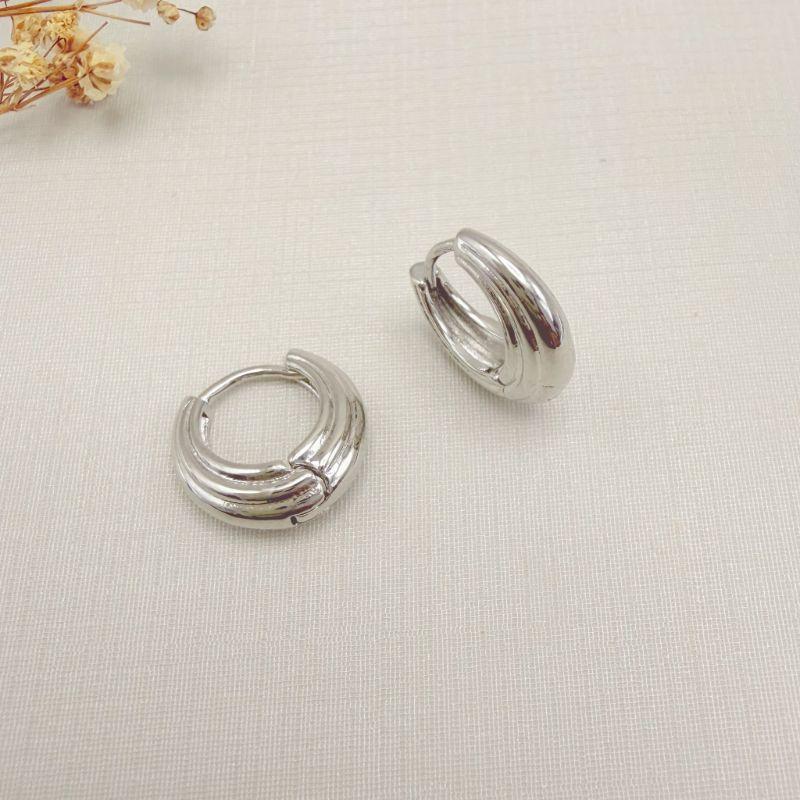 05.3128.0.B - Argola formato sacola em efeito reverberação