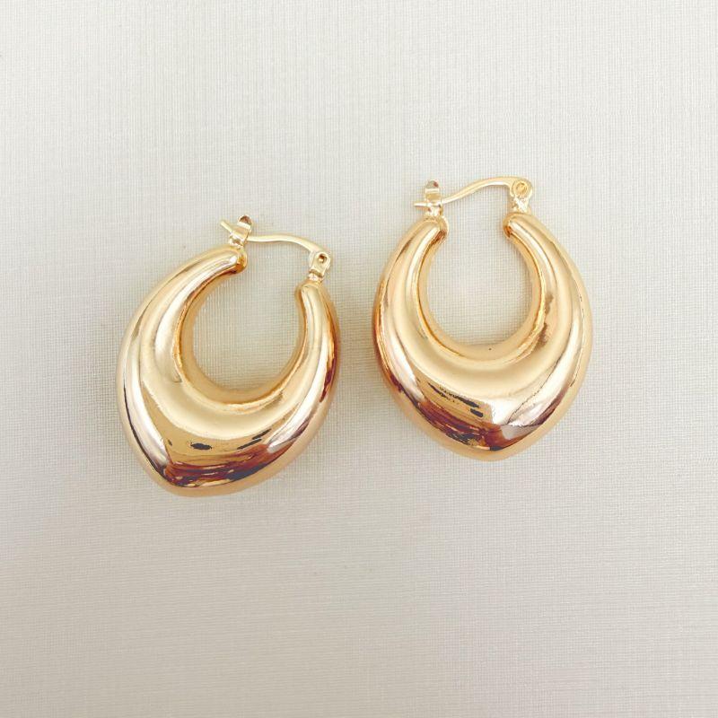 06.1358.0.O - Brinco estilo argola em fecho italiano em tubo formato navete liso