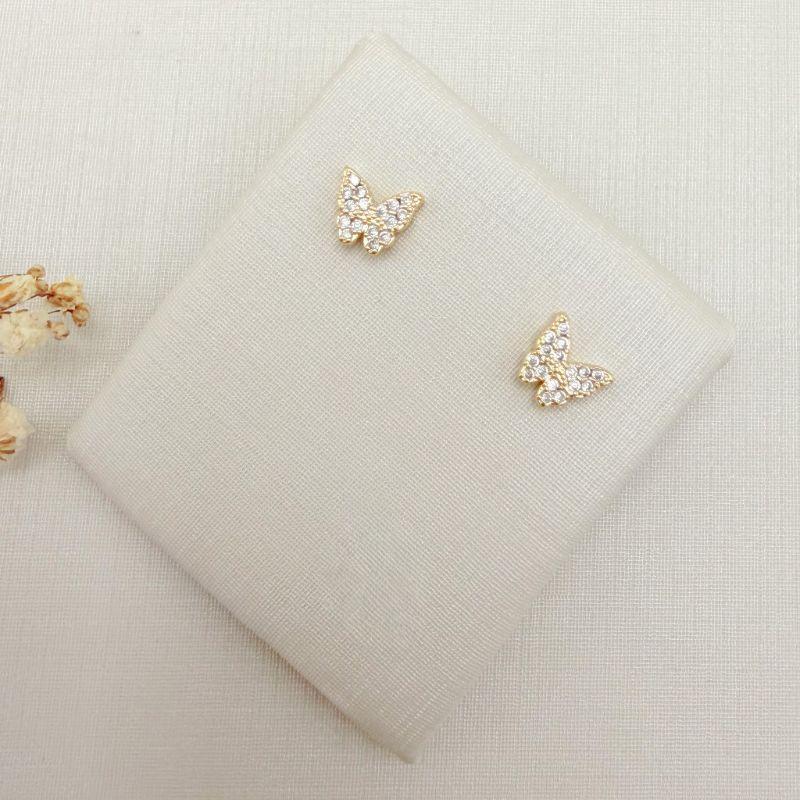 07.2856.1.O - Brinco de formato borboleta toda cravejada