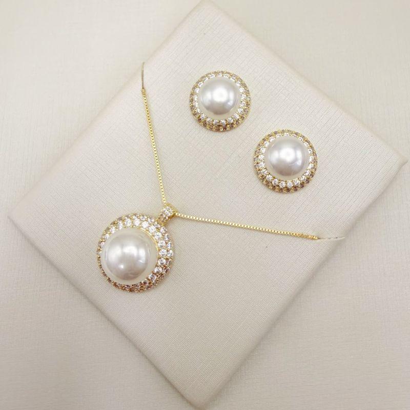 08.0616.15.O - (45) Conjunto de pérola circular com duas auras em volta