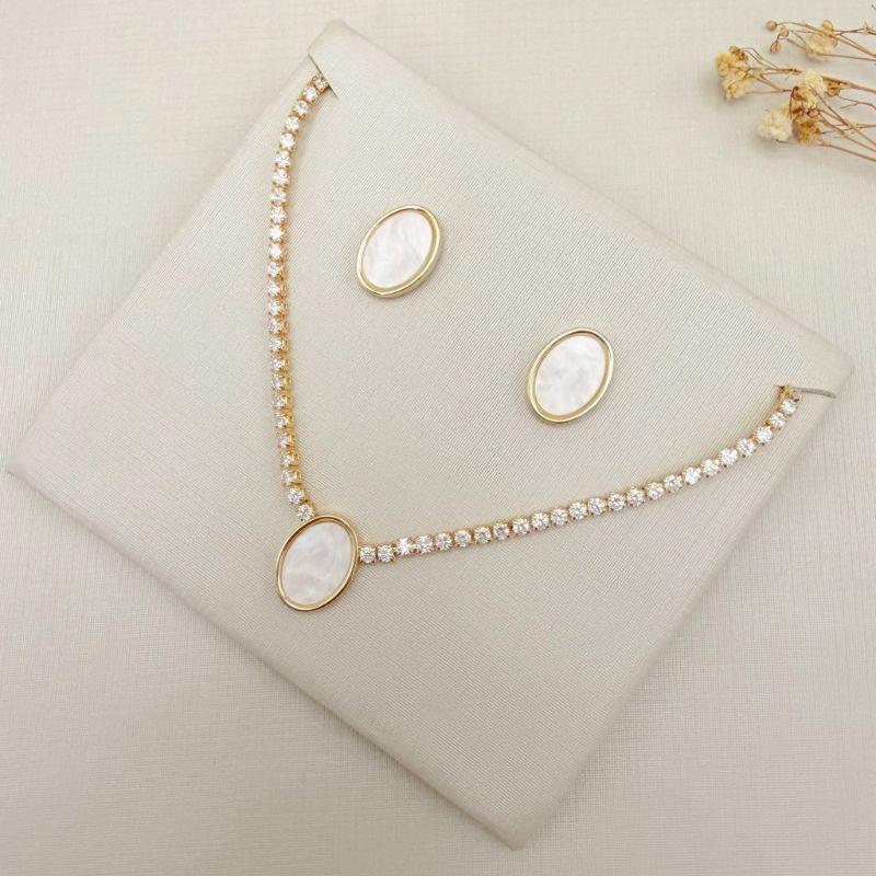 08.0619.15.O - (41) Conjunto de madre pérola oval com riviera em colar