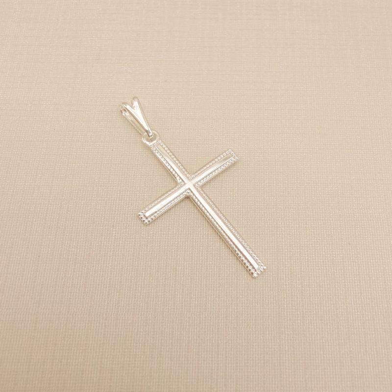11.0611.0.S - Pingente cruz 16x23mm lisa com borda pontilhada