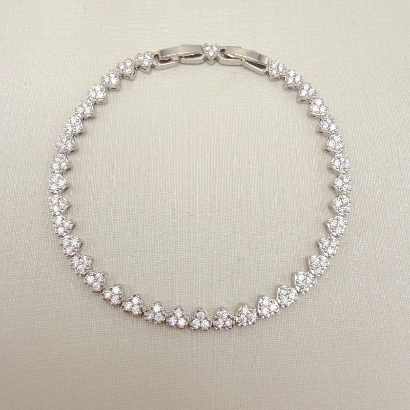 12.2283.1.B - Pulseira riviera em desenhos corações com fecho relógio