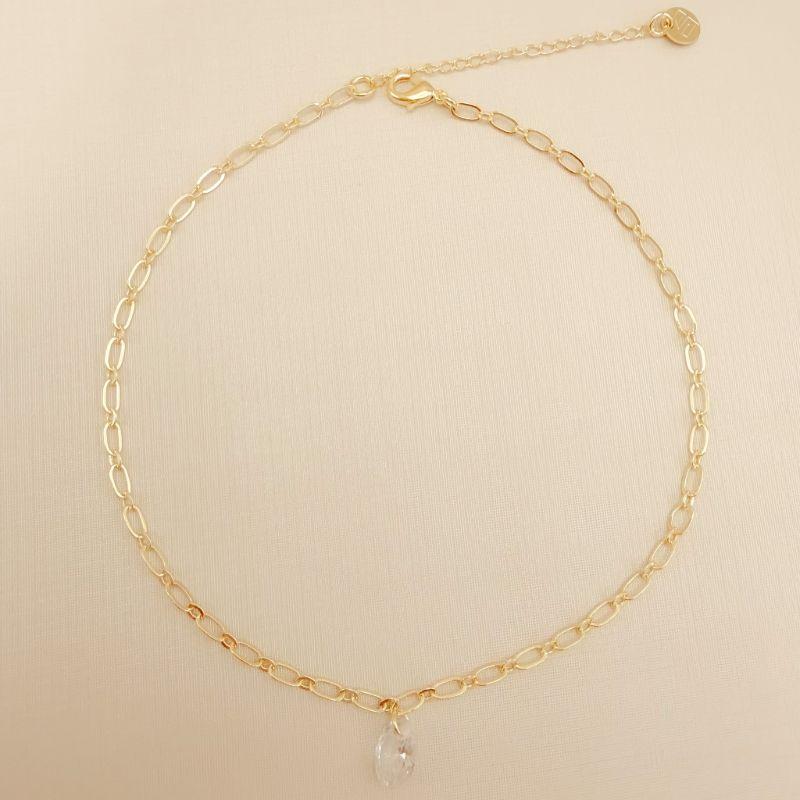 14.0311.1.O -Tornozeleira de elos ovais longos com pingente de ponto de luz oval