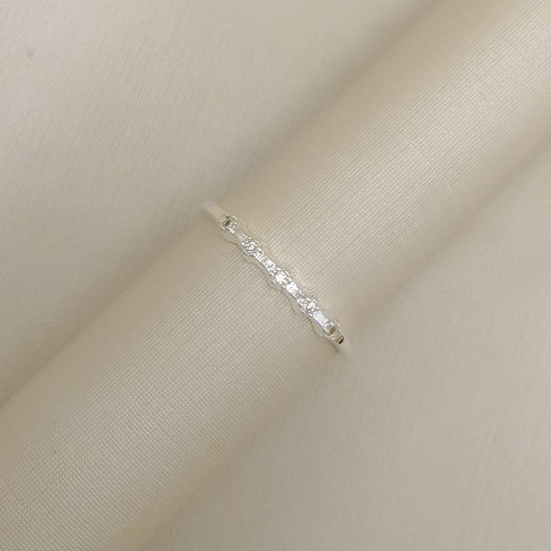 03.2559.1.S - (21) Anel estilo aparador cinco pontos de luz em cravação margarida espaçados