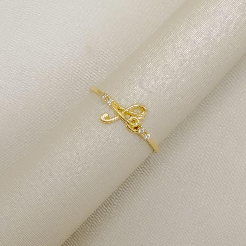 03.2564.1.O - (23) Anel e aro fino liso com escrita Fé e dois pontos de luz em cada lado