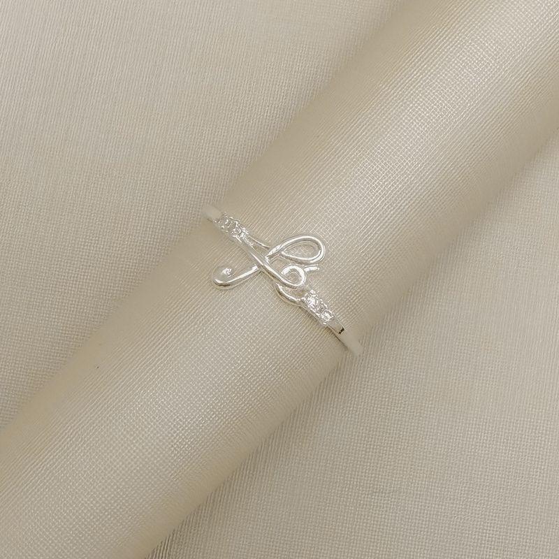 03.2564.1.S - (25) Anel e aro fino liso com escrita Fé e dois pontos de luz em cada lado