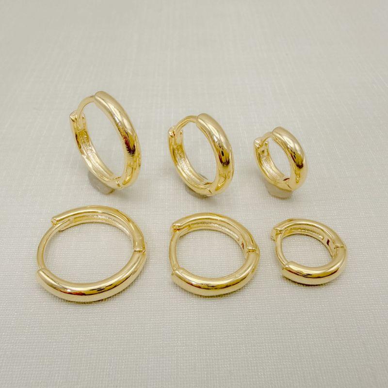 05.3163.0.O - Trio de argolas em tubo abaloado liso em formato clássico liso