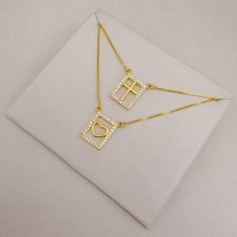 09.2048.1.O - (60) Escapulário de borda cravejada e silhueta coração e cruz