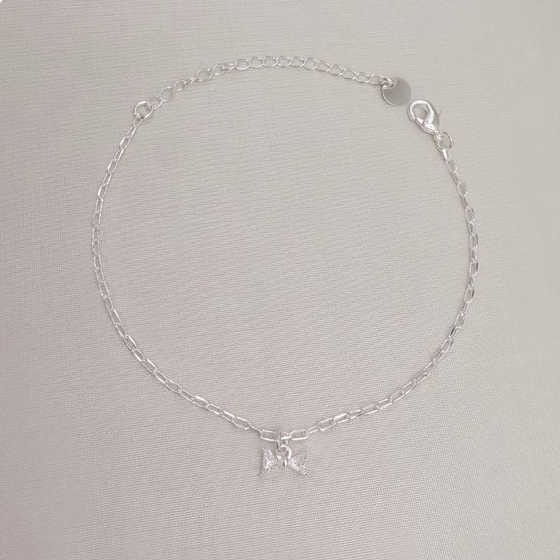 12.2315.1.S - Pulseira de elos americanos com pingente de laço em pontos de luz triangular