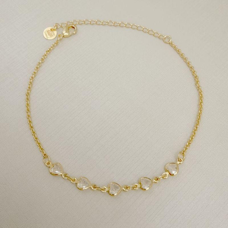 12.2316.1.O - Pulseira de elos português com cinco pontos de luz em coração