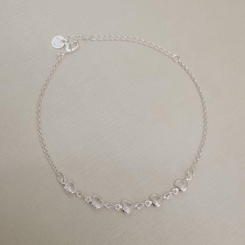 12.2316.1.S - Pulseira de elos português com cinco pontos de luz em coração