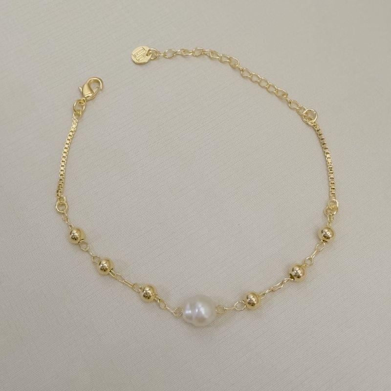 12.2334.15.O - Pulseira de bolinhas lisas com central de pérola de rio