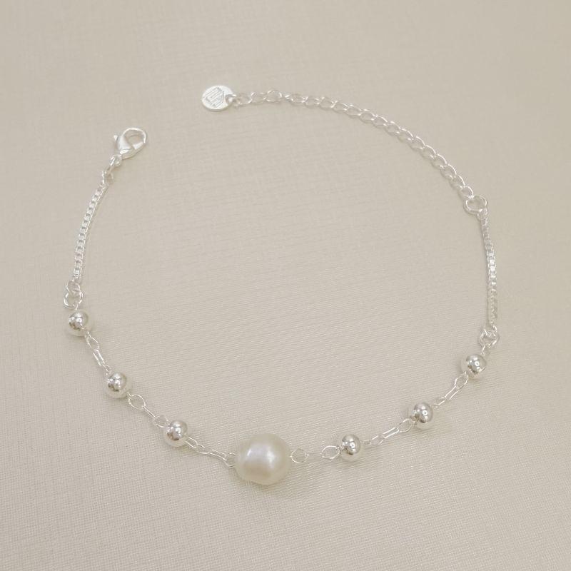 12.2334.15.S - Pulseira de bolinhas lisas com central de pérola de rio